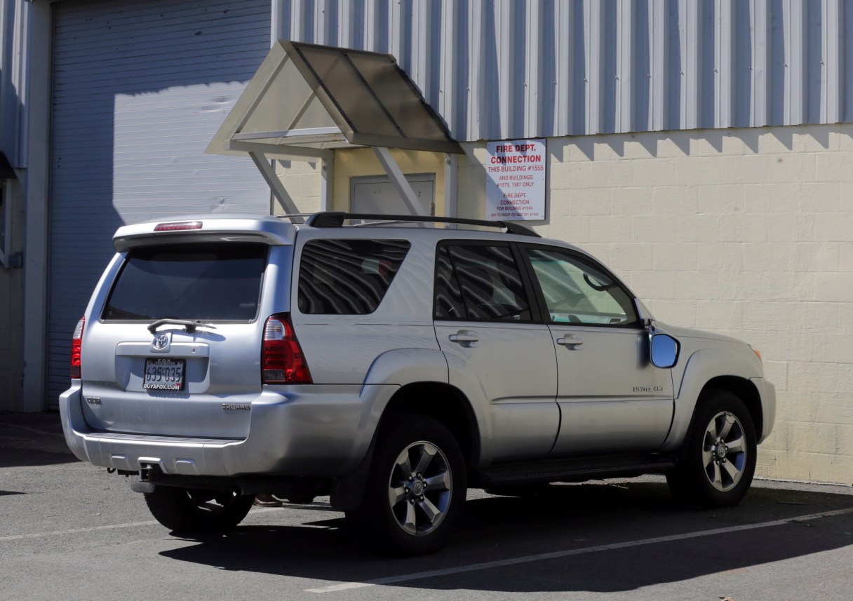 FILE - In this March 3, 2017, file, photo, the Toyota 4Runner held in a Boston Police evidence lot in the Hyde Park neighborhood of Boston is seen during a "view" of pertinent locations and evidence in the Aaron Hernandez trial. The vehicle, which prosecutors say Hernandez was in when he killed two men in 2012, is up for auction. The Boston Globe reports more than 60 people had placed bids on the Toyota 4-Runner on eBay as of Tuesday evening, May 2. The SUV’s owner is a Rhode Island car dealer, who leased it to Hernandez as part of a promotional agreement. The former New England Patriots tight end was acquitted in the double slaying on April 14. He was in prison for the killing of a man who was dating his fiancee’s sister. He hanged himself in his cell days later. (John Wilcox/The Boston Herald via AP, Pool, File)