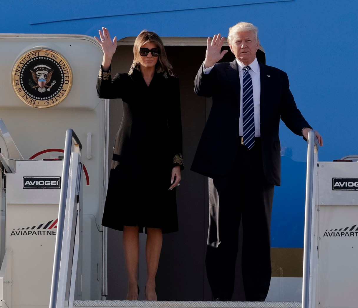 US President Donald Trump and his wife Melania arrive at Fiumicino's Leonardo Da Vinci International airport, near Rome, Tuesday, May 23, 2017. Trump is in Italy for a two day visit, including a meeting with Pope Francis at the Vatican, ahead of his participation in a NATO summit in Brussels on Thursday. (AP Photo/Andrew Medichini)