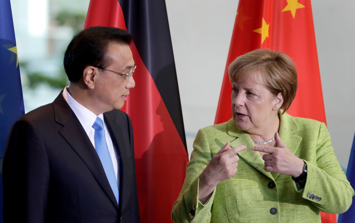 German Chancellor Angela Merkel, right, and China's Premier, Li Keqiang, left, talk during a contract signing ceremony as part of a meeting at the chancellery in Berlin, Germany, Thursday, June 1, 2017. (AP Photo/Michael Sohn)