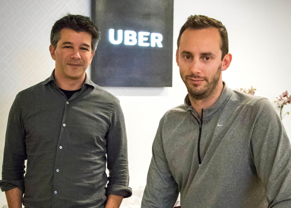 FILE - In this Thursday, Aug. 18, 2016, file photo, then-Uber CEO Travis Kalanick, left, and Anthony Levandowski, co-founder of Otto, pose for a photo in the lobby of Uber headquarters, in San Francisco. In a court filing on Thursday, June 22, 2017, Uber said it hired Levandowski, a former Google engineer now accused of stealing trade secrets, even though the company knew at the time that he had information that didn't belong to him. Uber hired Levandowski in August 2016 to head Uber's project on self-driving cars, something he worked on at Google. Uber is asserting that Kalanick told Levandowski not to bring the material with him and that Levandowski assured the company that he had destroyed the five discs containing Google information. Uber recently fired Levandowski. (AP Photo/Tony Avelar, File)