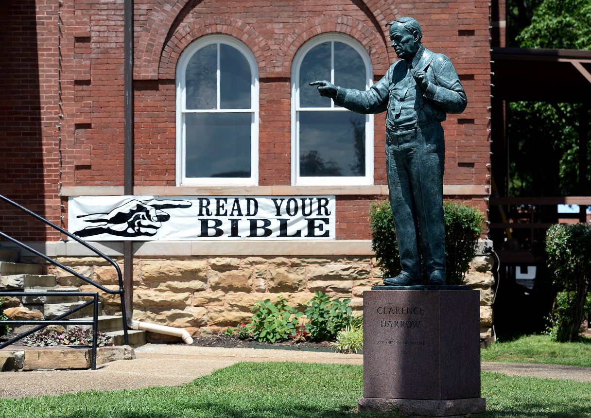 A statue of Clarence Darrow stands in front of the Rhea County Courthouse, Friday, July 14, 2017, in Dayton, Tenn. Darrow was the lawyer who defended John T. Scopes, a biology teacher, who fought Tennessee's law banning the teaching of evolution. (AP Photo/Mark Zaleski)