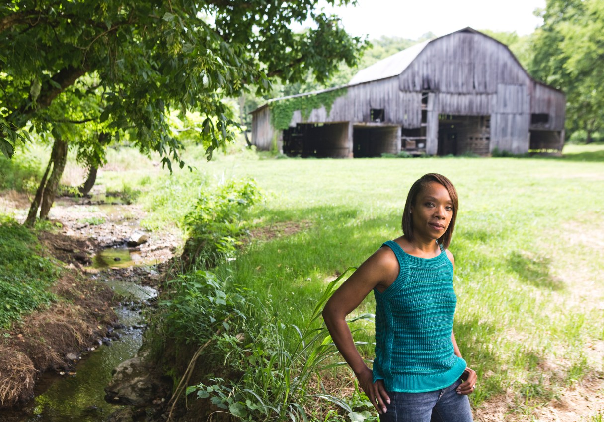Fawn Weaver on the farm she bought where Nearest Green and Jack Daniel first distilled whiskey together in the late 1880s, in Lynchburg, Tenn., June 21, 2017. Weaver, a real estate investor and author, is on a mission to ensure that Green, a former slave who taught Daniel how to make whiskey, is properly recognized. (Nathan Morgan/The New York Times)