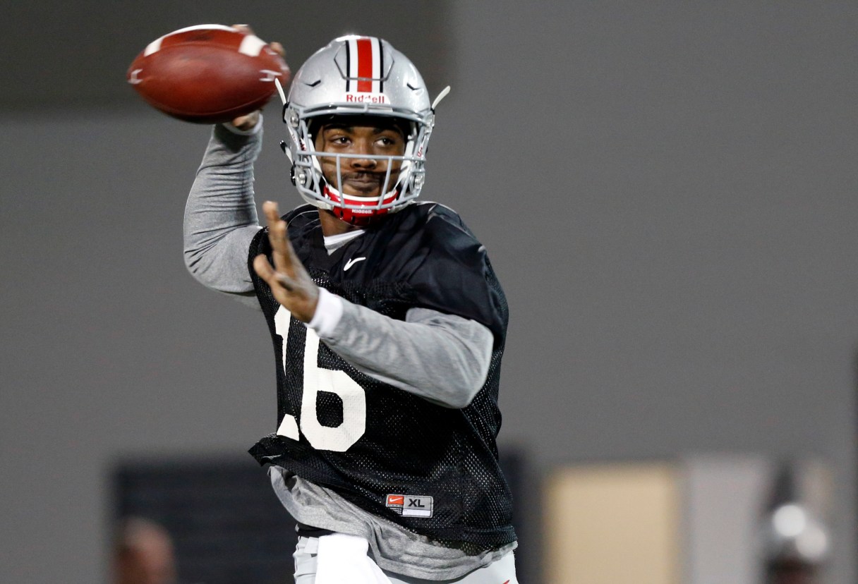 FILE - In this March 7, 2017, file photo, Ohio State quarterback J.T. Barrett runs a drill during an NCAA college football practice in Columbus, Ohio. Barrett is an oddity in modern college football, an elite player who stuck around for five years, a guy who helped win a national championship but still has something to prove. (AP Photo/Jay LaPrete, File)