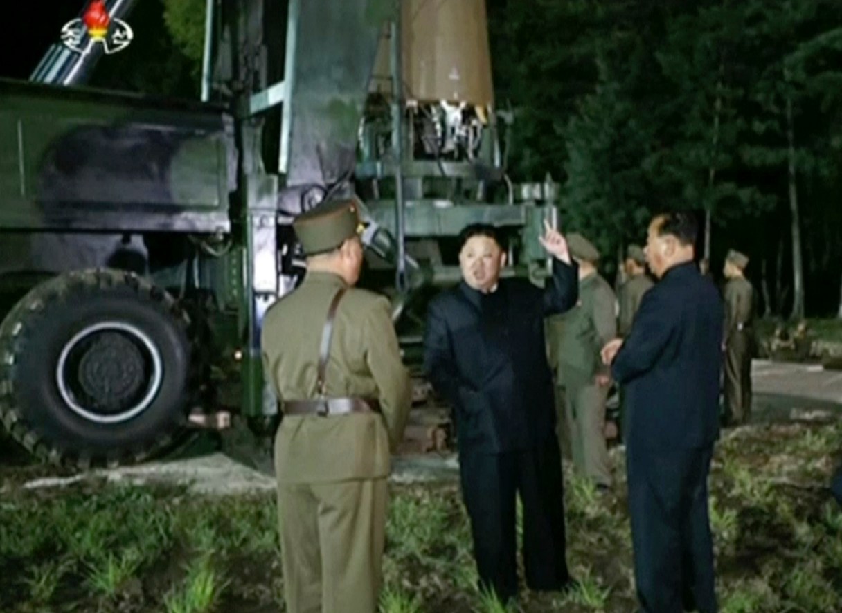 FILE - In this file image made from video by North Korea's KRT released on July 28, 2017, North Korean leader Kim Jung Un, second from right, gestures at the site of a missile test at an undisclosed location in North Korea. North Korea claims it is in the final stages of preparing a plan to launch four intermediate-range ballistic missiles over Japan and into waters just off the island of Guam, where about 7,000 U.S. troops are based. Kim has radically accelerated the pace of the North's missile development, and many experts believe it could have an intercontinental ballistic missile able to hit major American cities within a year or two. (KRT via AP Video, File)