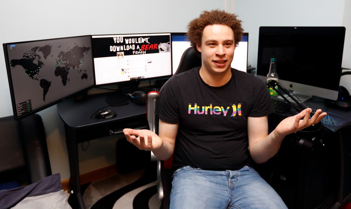 FILE - In this Monday, May 15, 2017, file photo, British IT expert Marcus Hutchins speaks during an interview in Ilfracombe, England. Hutchins, a young British researcher credited with derailing a global cyberattack in May, has been arrested for allegedly creating and distributing banking malware, U.S. authorities say. Hutchins was detained in Las Vegas on Wednesday, Aug. 2, 2017, while flying back to Britain from Defcon, an annual gathering of hackers of IT security gurus. A grand jury indictment charges Hutchins with “creating and distributing” malware known as the Kronos banking Trojan. (AP Photo/Frank Augstein, File)