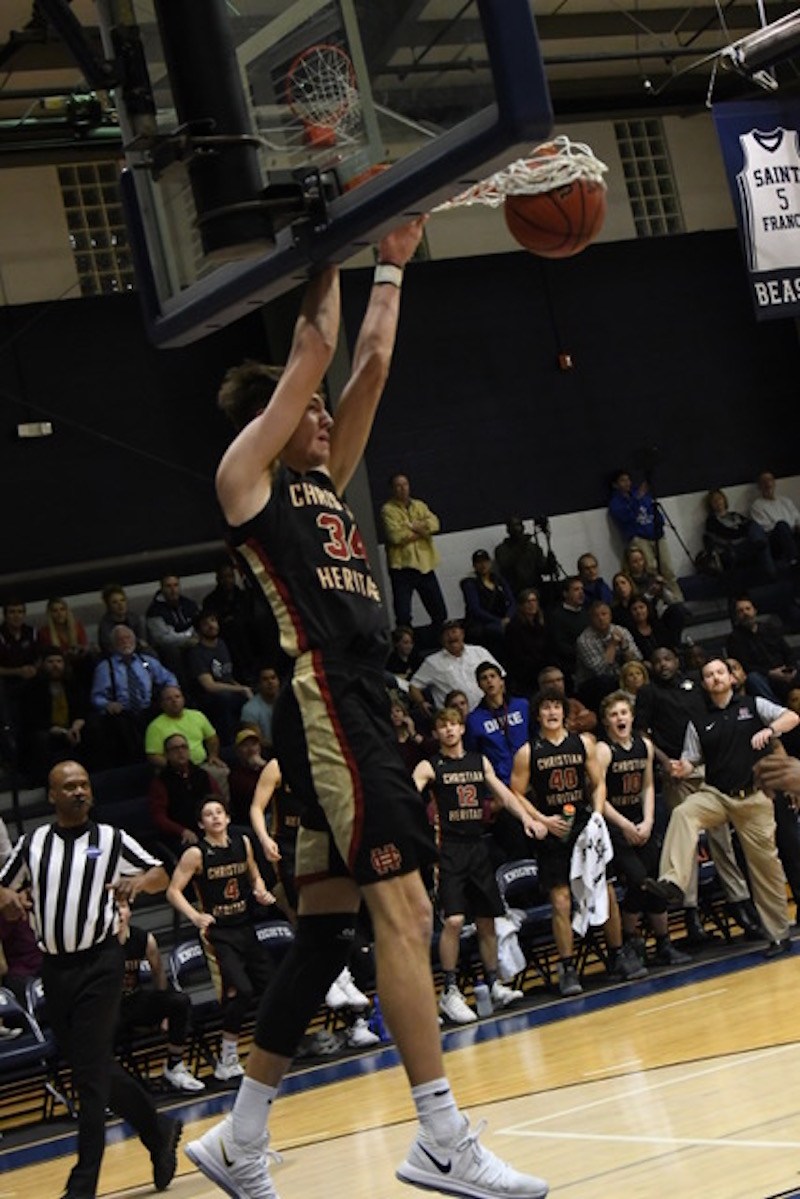 Christian Koneman capped Christian Heritage's upset of top-ranked St. Francis in the Region 6-A tournament with this dunk.