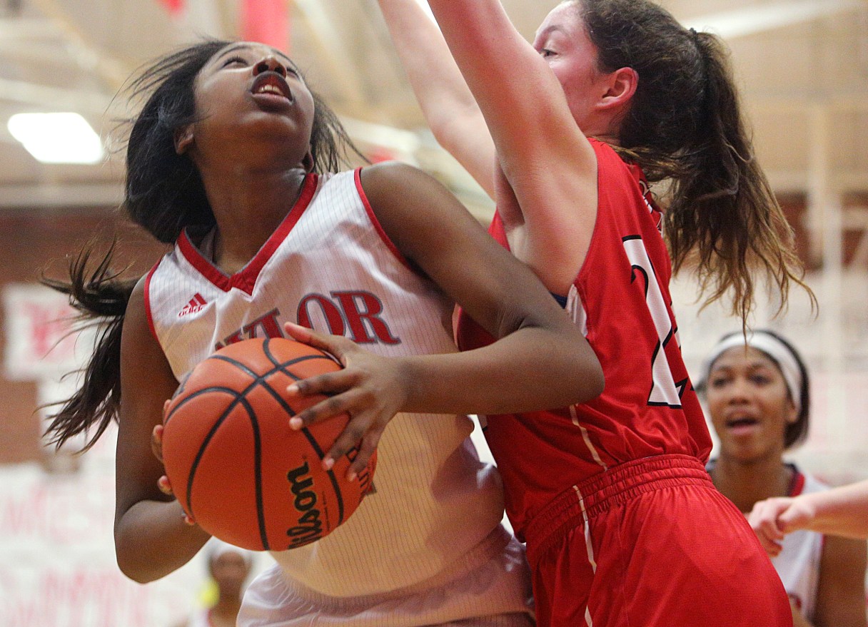 Baylor's Raegyn Conley (11) puts up a shot while being guarded by St. Cecilia's Sarah Davis (24) during the Baylor vs. St. Cecilia girls' basketball game Tuesday, Feb. 20, 2018 at Baylor School in Chattanooga, Tenn.