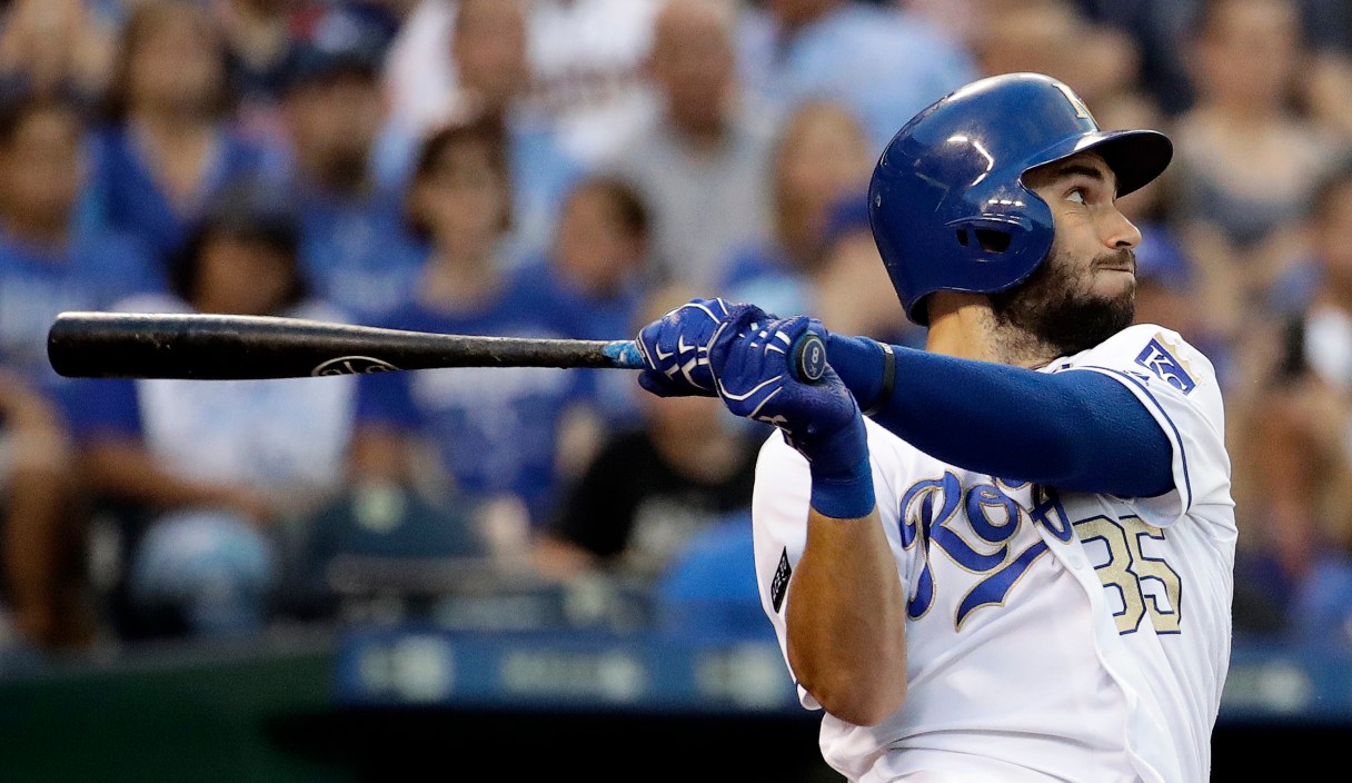 FILE - In this June 30, 2017, file photo, Kansas City Royals' Eric Hosmer hits a three-run home run during the fourth inning of a baseball game against the Minnesota Twins, in Kansas City, Mo. Perhaps 100 free agents still seek contracts as the start of spring training workouts on Feb. 14 draws near, a group that includes J.D. Martinez, Eric Hosmer, Mike Moustakas, Jake Arrieta and Yu Darvish.(AP Photo/Charlie Riedel, File)