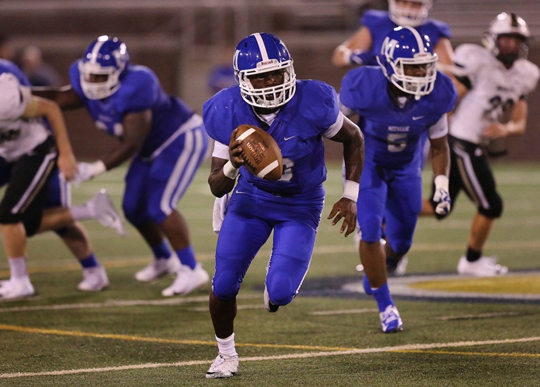 Staff photo by Erin O. Smith /
McCallie quarterback DeAngelo Hardy (10) runs with the ball during the McCallie vs. Bradley Central game in the Best of Preps football jamboree Friday, August 10, 2018 at Finley Stadium in Chattanooga, Tennessee.
