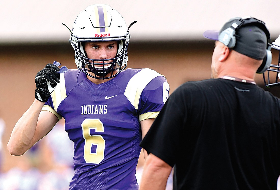 Sequatchie's Spencer Ables (6) confers with head coach Adam Caine in this Aug. 11, 2017, staff file photo.