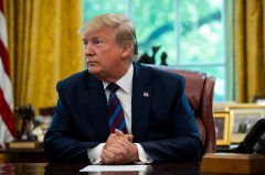 President Donald Trump sits in the Oval Office recently. About half of registered voters believe Trump is racist, according to a new national poll released in July. The poll shows voters are sharply divided along partisan lines on the question. (Anna Moneymaker/The New York Times)