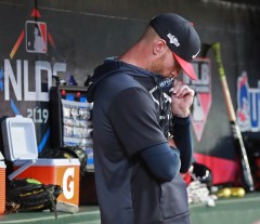 Atlanta Braves pitcher Mike Foltynewicz stands in the dugout during the ninth inning of the team's 13-1 loss to the St. Louis Cardinals during Game 5 of a baseball National League Division Series on Wednesday, Oct. 9, 2019, in Atlanta. The Cardinals advanced to the NL Championship Series. (Curtis Compton/Atlanta Journal-Constitution via AP)