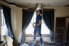 Allan Chambers works to bring a client's DIY project up to code. / Staff photo by C.B. Schmelter