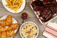 Photo from Cheddar's Scratch Kitchen / House-smoked baby back ribs are among the entrees in the Family Bundles to go at Cheddar's Scratch Kitchen. You also get a choice of two family-size sides and six of the restaurant's signature honey-butter croissants. Bundles start at $24.99 and also include chicken tenders and salmon.