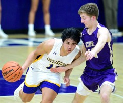 Staff photo by Robin Rudd / Boyd-Buchanan's Ryan Lopez brings the basketball downcourt as a Christ Presbyterian Academy player defends during a TSSAA Division II-A state quarterfinal on Saturday night at Boyd-Buchanan. The host Buccaneers lost 72-52.