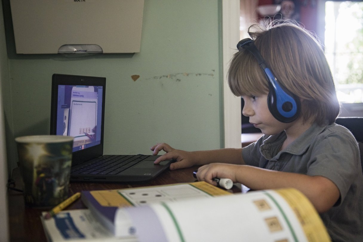 Staff File Photo By Troy Stolt / Lakeside Academy student Emmett Loylass, 5, completes virtual learning coursework at home last September.