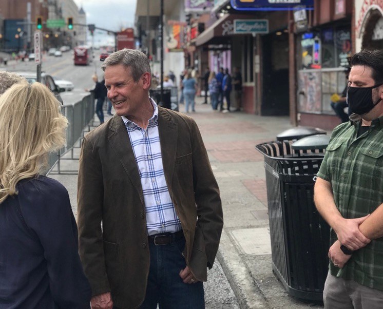 Gov. Bill Lee chats maskless outside on Lower Broadway in Nashville. The city still has a mask mandate in effect. / Photo provided by Gov. Bill Lee