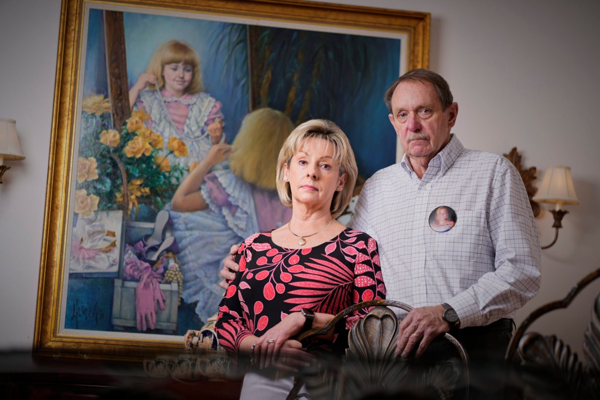 Joan and Michael Berry, Johnia Berry's parents, are pictured in their Knoxville home. A portrait of Johnnia as a little girl hangs in the background./Photo by Patrick Murphy-Racey