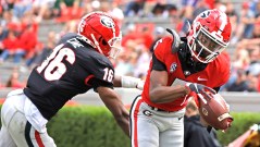Georgia photo by Andrew Davis Tucker / Georgia freshman receiver Adonai Mitchell hauls in a touchdown reception with Lewis Cine defending during Saturday's G-Day game inside Sanford Stadium.