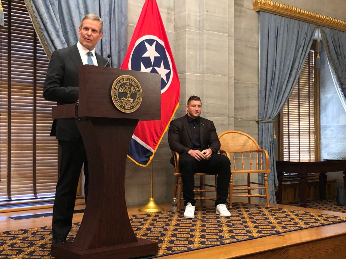 Tennessee Gov. Bill Lee announces $5.4 million in grants to groups for state-funded effort to combat human trafficking on Thursday, May 13, 2021, in a state Capitol news conference. Among recipients was a foundation created by former NFL player Tim Tebow, pictured at right. (Photo by Andy Sher/Chattanooga Times Free Press)