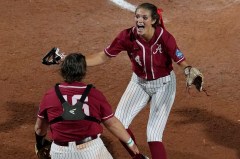 AP photo by Sue Ogrocki / Alabama pitcher Montana Fouts, right, celebrates her perfect game with catcher Bailey Hemphill after the Crimson Tide beat UCLA 6-0 on Friday night at the Women's College World Series.