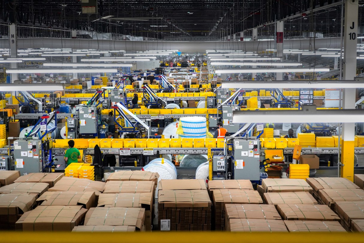 A workers in the packing area at Amazon's warehouse on Staten Island, called JFK8, on March 2, 2021. Each year, hundreds of thousands of Amazon workers churn through a vast mechanism that hires and monitors, disciplines and fires. (Chang W. Lee/The New York Times)