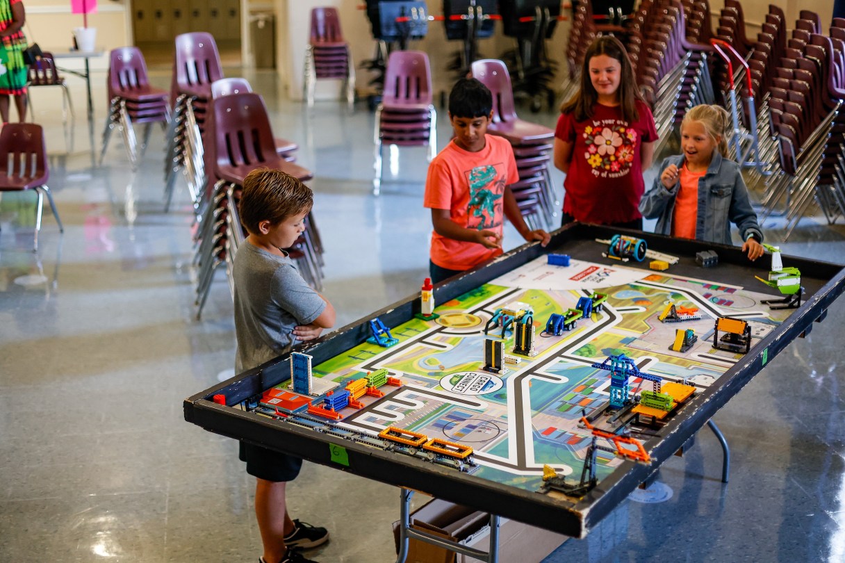 Staff photo by Troy Stolt / CSLA students Hudson Greene, 9, Jayanth Siddenki, 9, Aubrey McBrayer, 10, and Lauren Commander, 10, plan a strategy for their LEGO robots, which they will use to complete challenges in the First LEGO League Challenge later this month.