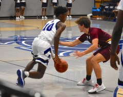 Staff photo by Patrick MacCoon / CSAS' Justin Brown drives with the ball in Monday's game against Grace Academy.