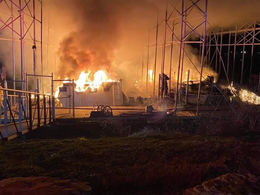 Contributed photo by Haletown Volunteer Fire Department / Firefighters battled a blaze Jan. 27 that destroyed two boats at Hales Bar Marina and Resort and left searchers looking for a man who went missing in the fire. Search efforts continued Tuesday.