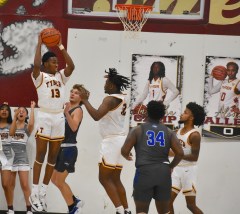 Staff photo by Patrick MacCoon / Tyner's Keelan Jackson comes down with a rebound.