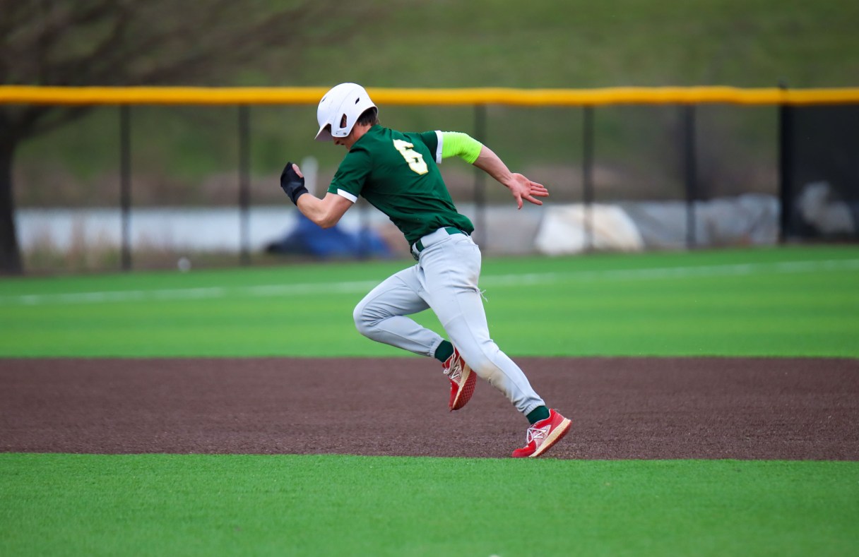 Staff photo by Olivia Ross / Silverdale's Brett Rogers sprints to 3rd. Boyd Buchanan took on Silverdale Baptist at home on March 29, 2022.