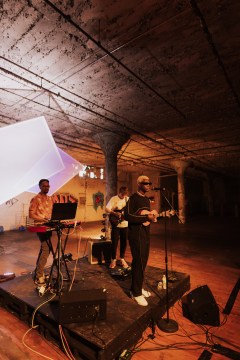 Kelly Lacy / Mon Rovia, center, performs during an earlier pop-up show at the former Standard-Coosa-Thatcher Mill in Mill Town along with Summer Dregs, left and Miles Lovely.