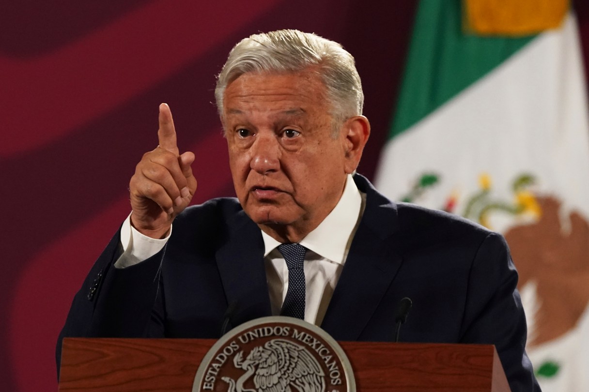 FILE - Mexico's President Andres Manuel Lopez Obrador speaks during his daily press conference at the National Palace, in Mexico City, Wednesday, June 22, 2022. Lopez Obrador appealed to the country’s citizens Tuesday, Dec. 27, not to accept holiday handouts and gifts from drug gangs, after videos posted online showed garish pickup trucks handing out loads of gifts while bystanders described the drivers as members of the Jalisco drug cartel. (AP Photo/Marco Ugarte, File)
