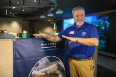 Staff photo by Olivia Ross / Jeff Worley, senior manager of exhibit services at the Tennessee Aquarium, speaks about the new Ridges to Rivers gallery on Friday. Worley stands next to what will be the new sturgeon touch tank. The gallery will feature a new sturgeon touch tank, an interactive pop up tank, different drainage tanks and more