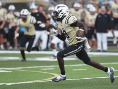 Staff photo by Matt Hamilton / Bradley Central's Marcus Goree Jr. runs for a touchdown after a catch against visiting Walker Valley on Aug. 26, 2022.