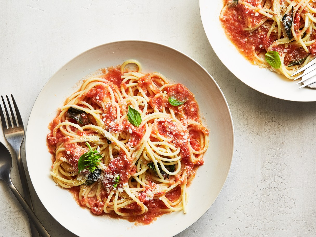 The best way to showcase the flavor of prime summer tomatoes is to cook them as minimally as possible, if at all. This grilled tomato pasta only warms the fruit. / Armando Rafael/The New York Times