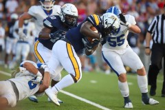 Staff photo by Olivia Ross / CCSs DaRell Brown (4) attempts to get past McCallie. Chattanooga Christian School took on McCallie at home on Friday, August 18, 2023.