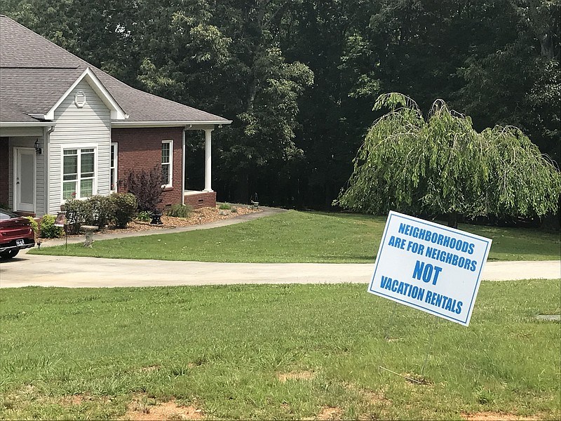 Staff file photo by Emily Crisman / A sign, opposing short-term vacation rentals, is displayed in a yard of a home in an unincorporated area of Hamilton County.