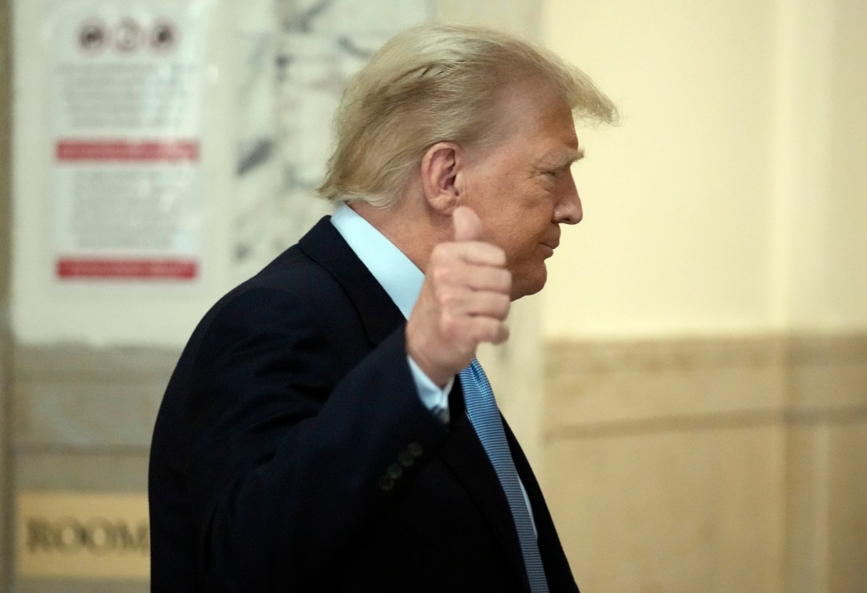 Former President Donald Trump returns to the courtroom after a break of his civil business fraud trial at New York Supreme Court, Wednesday, Oct. 18, 2023, in New York. (AP Photo/Seth Wenig)