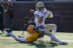 Staff photo by Olivia Ross / Christ Presbyterian Academy's Owen Cabell carries the football into the end zone as Boyd Buchanan’s Isaac Summey tries to bring him down during the TSSAA Division II-AA BlueCross Bowl on Thursday at Finley Stadium.