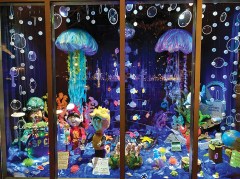 Staff photo by Kathy Bradshaw / Jellyfish dangle in an EPB window to fit the “Under the Sea” theme that year.