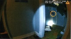 Hamilton County District Attorney's Office / Hamilton County District Attorney Coty Wamp said an image taken from officer body camera footage appears to show David Mendez Lopez holding a gun while officers are inside Mendez Lopez's home on Sept. 2. Selected still images were released but not the video from which they were captured.