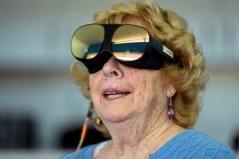 Karen Audet, an 82-year-old retired elementary school teacher, wears a Mynd Immersive virtual reality headset at John Knox Village, Wednesday, Jan. 31, 2024, in Pompano Beach, Fla. John Knox Village was one of 17 senior communities around the country that participated in a recently published Stanford University study that found that large majorities of 245 participants between 65- and 103-years-old enjoyed virtual reality, improving both their emotions and their interactions with staff. (AP Photo/Lynne Sladky)