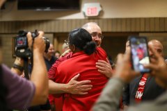 Staff photo by Olivia Ross / UAW President Shawn Fain hugs union supporters Friday after a win at Volkswagen Chattanooga. Union supporters gathered Friday at the International Brotherhood of Electrical Workers waiting for election results.