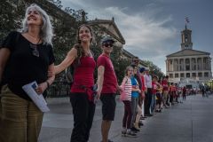 Voices for a Safer Tennessee organized an April 2023 event in which volunteers formed a human chain from Vanderbilt University Medical Center, where victims of the Covenant School shooting were taken, to the Tennessee Capitol. The group is a 501(c)(4) political advocacy group and a political action committee, allowing it to shield the names of donors. / Tennesse Lookout Photo by John Partipilo