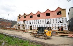 Staff photo by Matt Hamilton/ Apartments are seen under construction in the Mill Town area March 8.