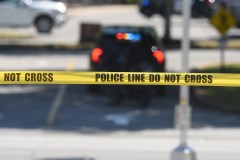 Staff file photo by Matt Hamilton / Police tape flutters in the breeze in the parking lot at Hamilton Place mall. A study released Sept. 25 shows that while crime is down in Chattanooga, increased homelessness and disorder may lead residents to feel like the city is more dangerous.