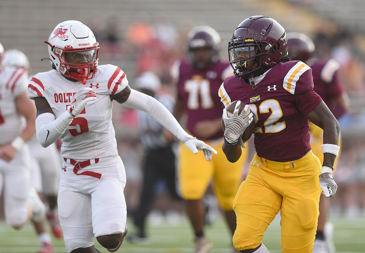 Staff file photo by Matt Hamilton / Tyner freshman De'Aerion McNealy, with ball, helped lead the Rams to a 31-28 overtime win at state-ranked Marion County on Friday.