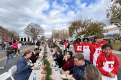 Staff Photo by Alison Gerber / Dalton High School students help serve at the event. People gathered on Monday, Nov. 21, for Gratefull Dalton, a community-wide Thanksgiving meal shared at one long table on Hamilton Street in downtown Dalton, Georgia.