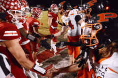 Staff photo by Robin Rudd / Football team captains for host Whitwell, left, and cross-county rival South Pittsburg shake hands at midfield before Friday night's TSSAA Region 3-1A title showdown.